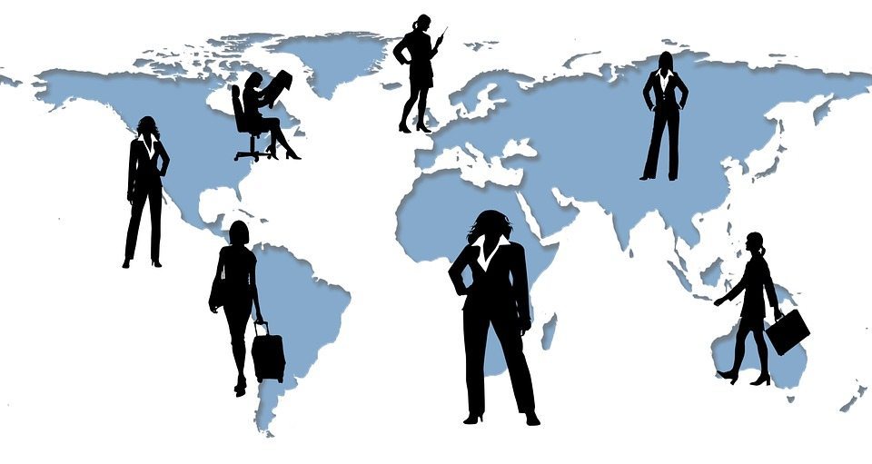 women silhouettes on a world map
